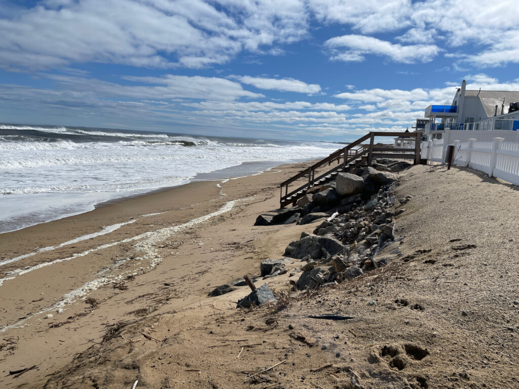 a beach with rocks and a pier (MyCoast AI)