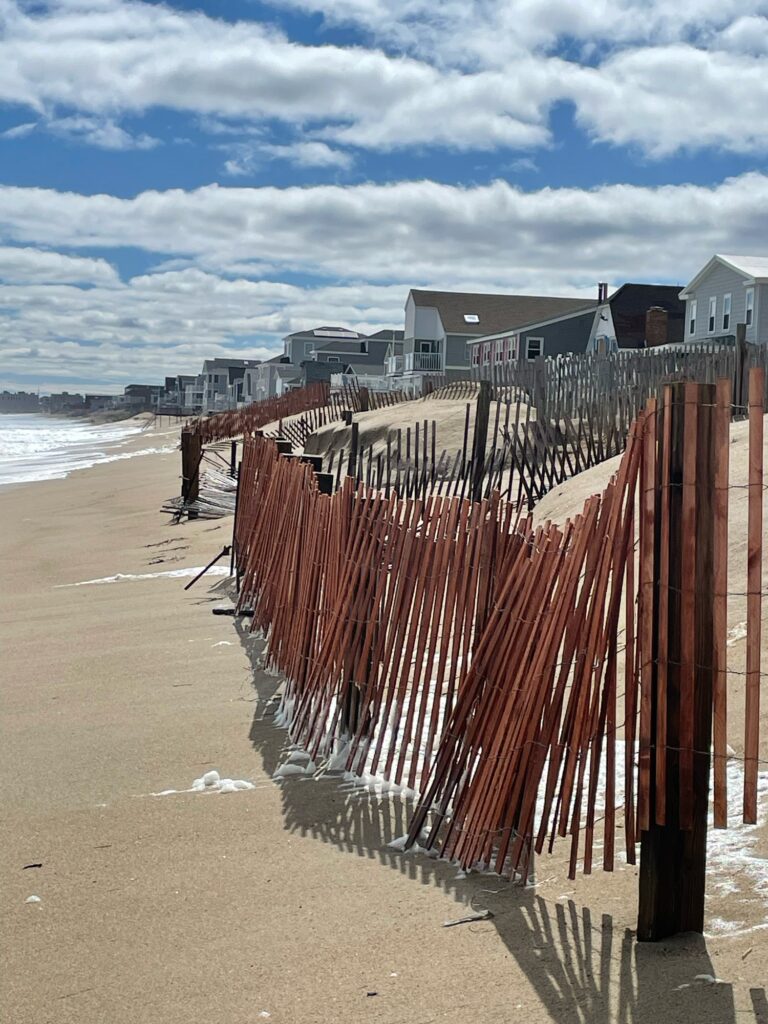 a wooden fence on a beach (MyCoast AI)