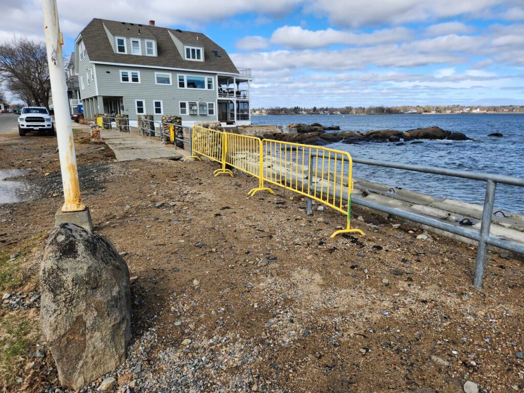 a yellow fence on a beach (MyCoast AI)