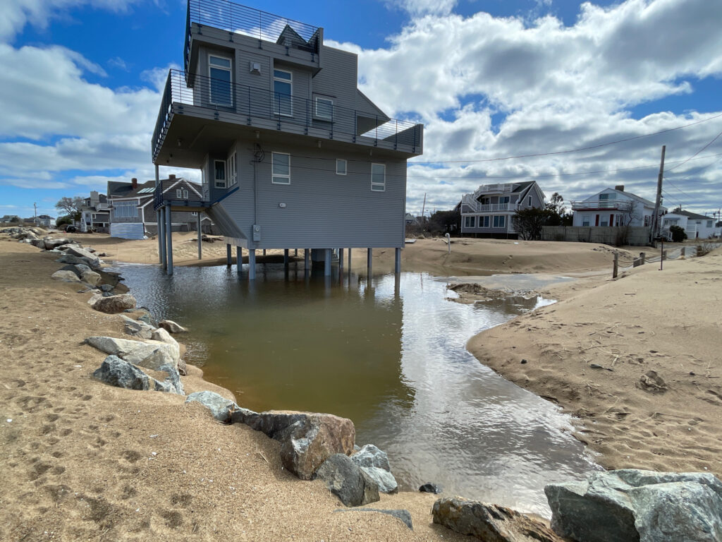 a building next to a body of water (MyCoast AI)