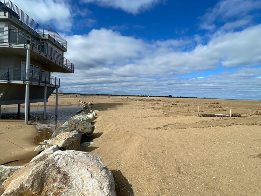 a sandy beach with a building (MyCoast AI)