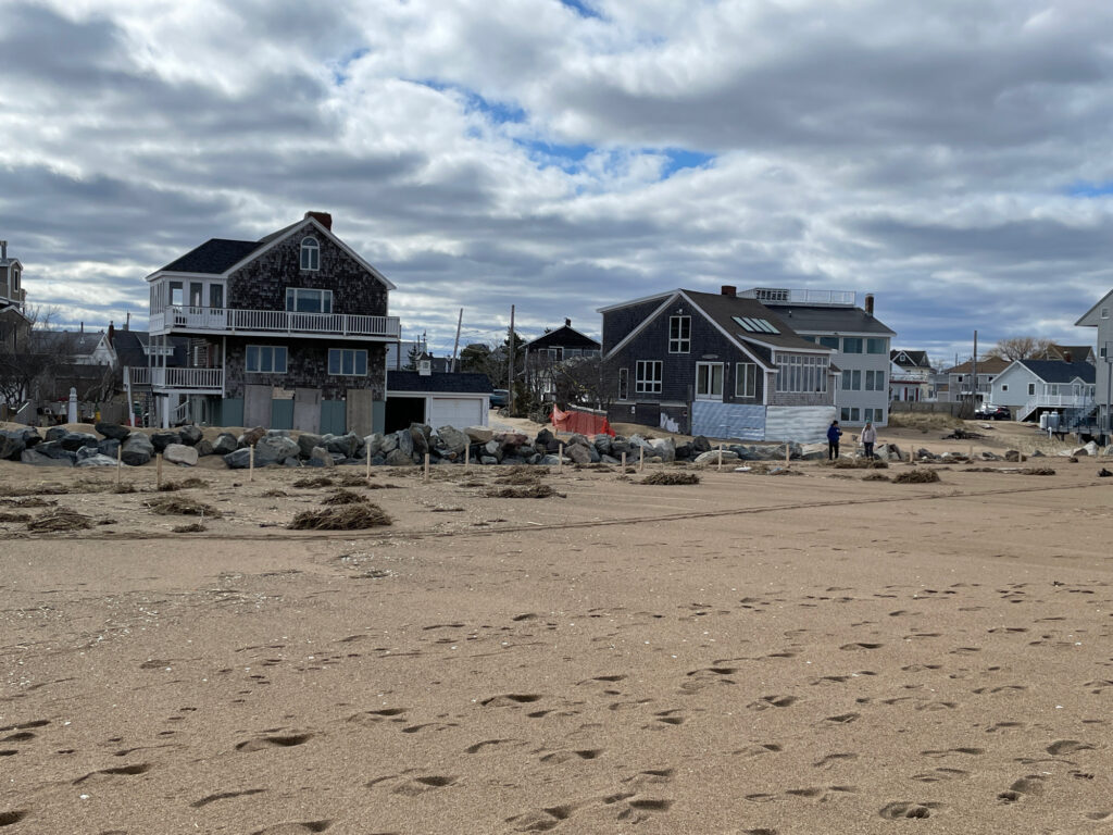 a group of houses on a beach (MyCoast AI)