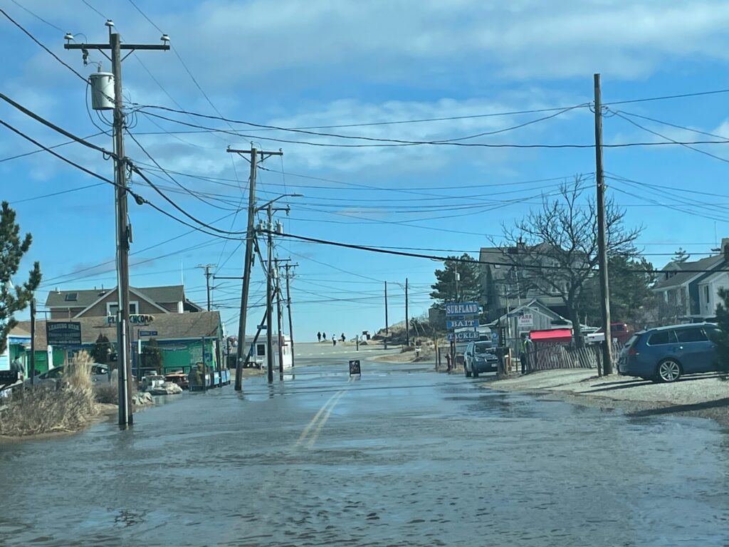 a street with power lines and buildings (MyCoast AI)