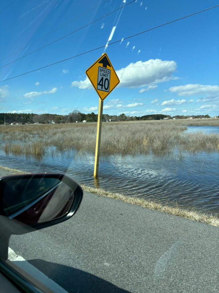 a yellow sign on a road (MyCoast AI)