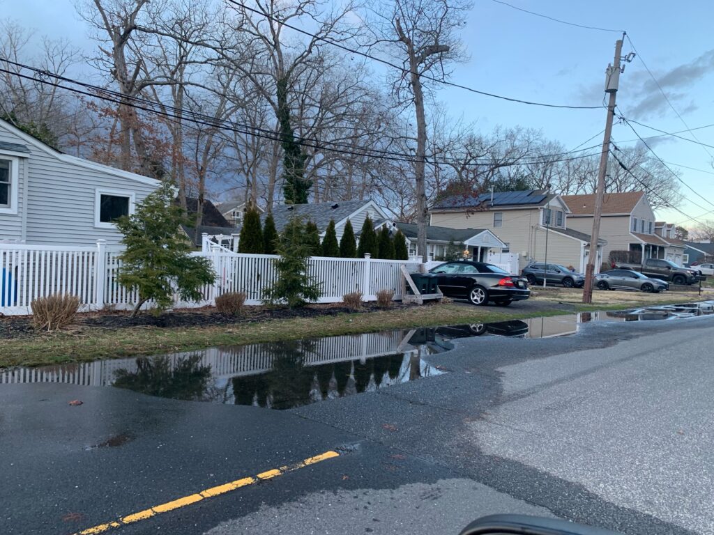 a puddle of water in a neighborhood (MyCoast AI)