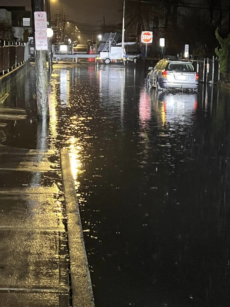 a flooded street with cars (MyCoast AI)