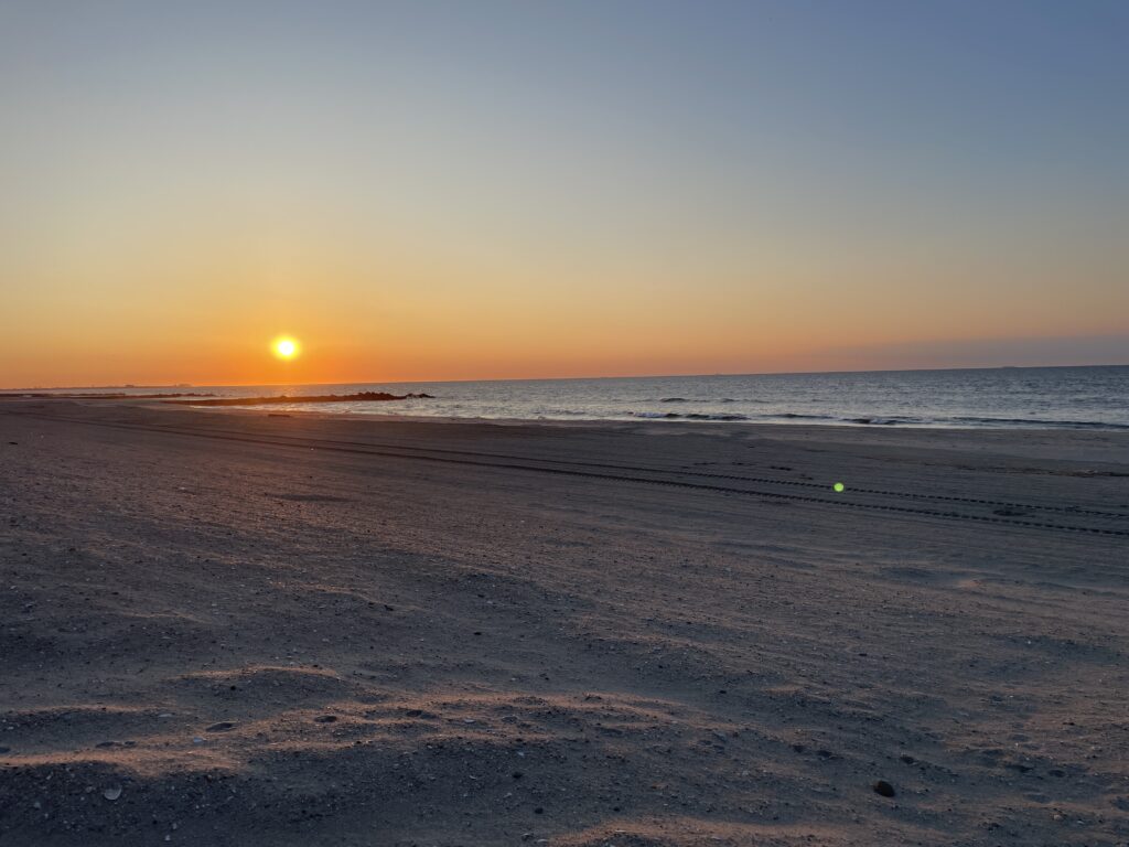 a beach with a sunset (MyCoast AI)