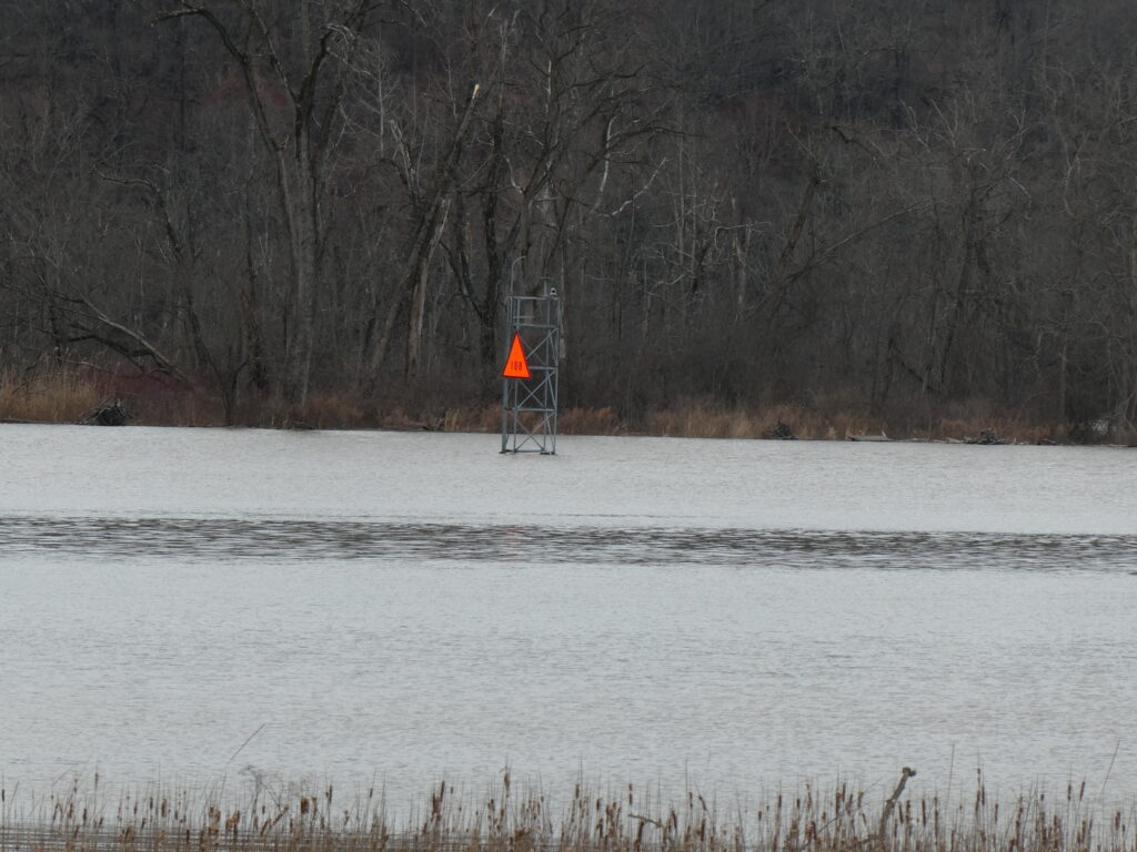 a yellow sign in a lake (MyCoast AI)