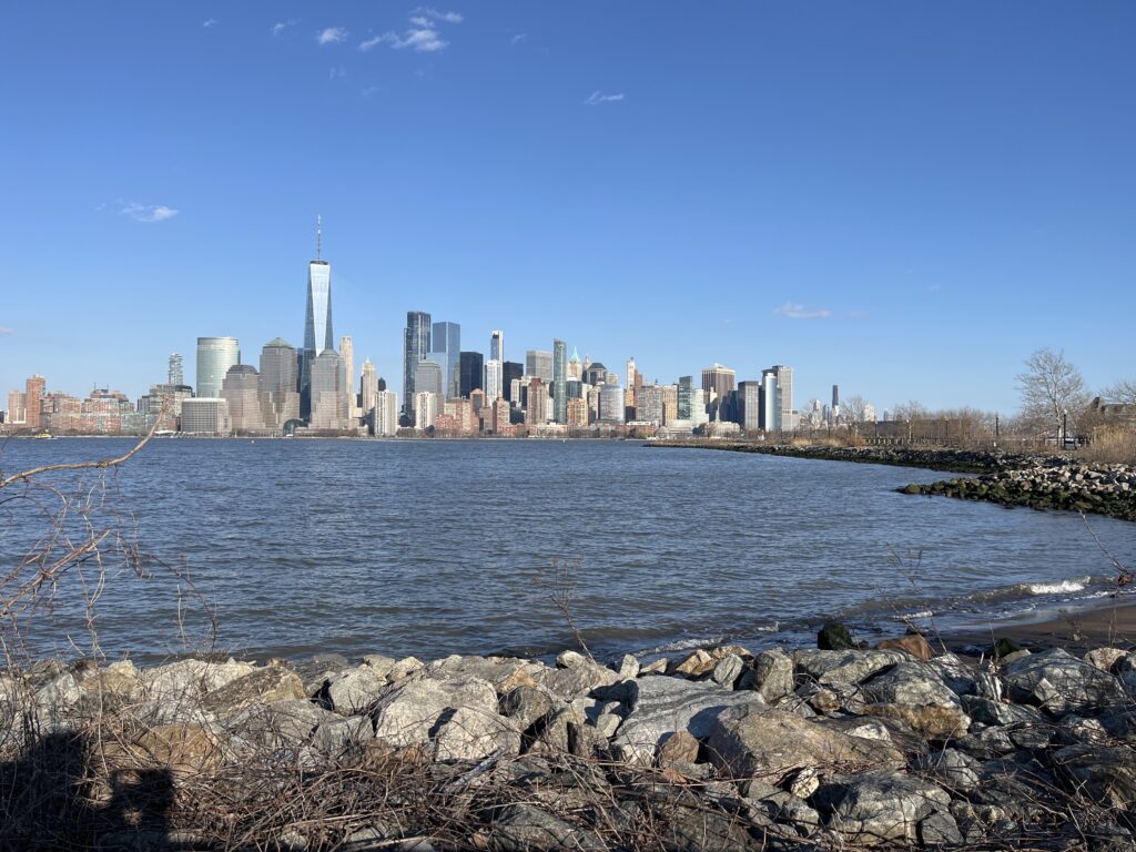 a city skyline across a body of water (MyCoast AI)