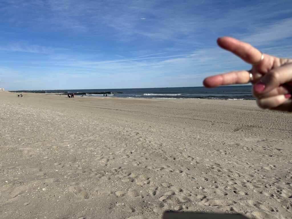 a hand on a beach (MyCoast AI)
