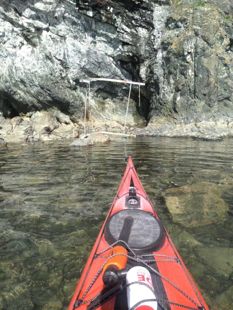 a red kayak in a river (MyCoast AI)