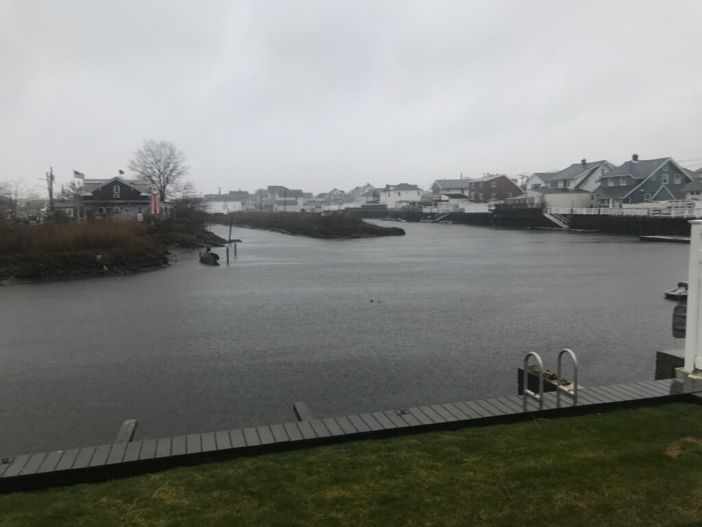 a body of water with houses along it (MyCoast AI)