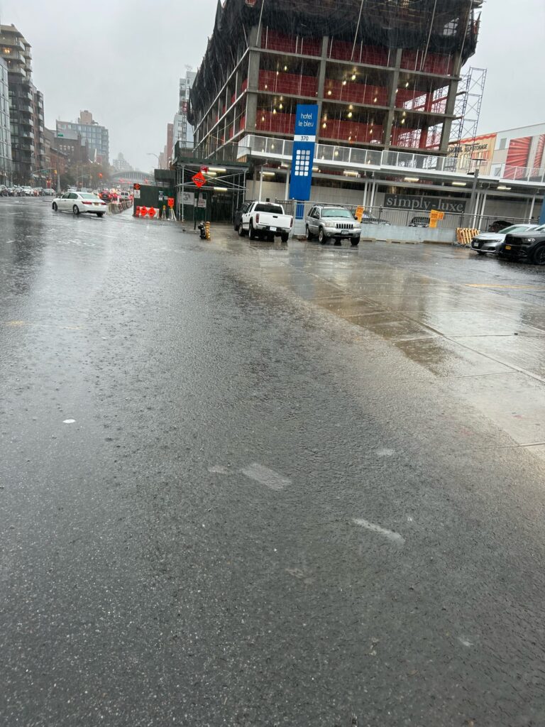 a street with cars and buildings (MyCoast AI)