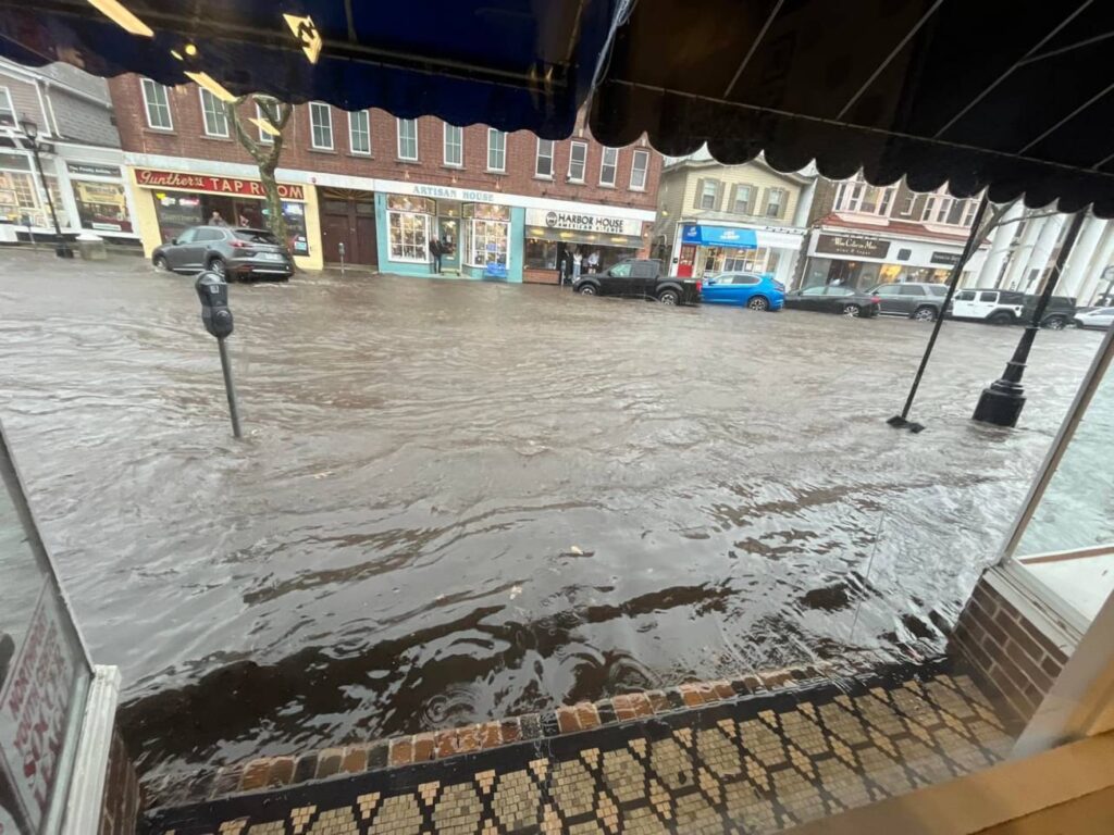 a flooded street with cars and buildings (MyCoast AI)