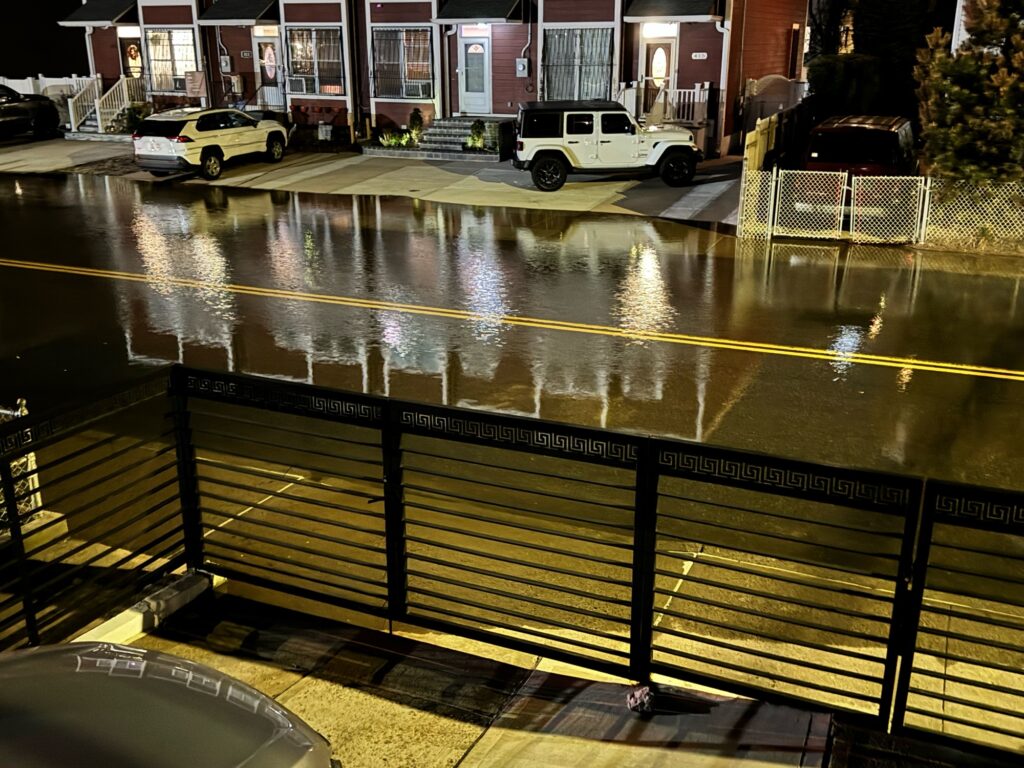 a street with cars and buildings (MyCoast AI)