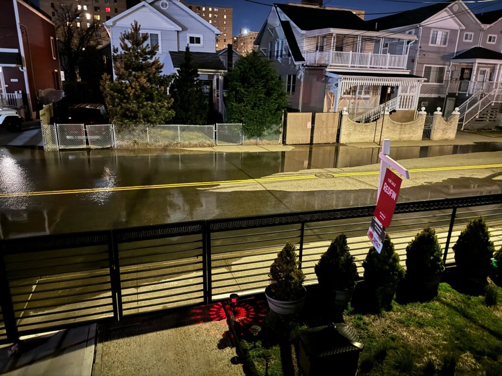 a flooded street with houses (MyCoast AI)