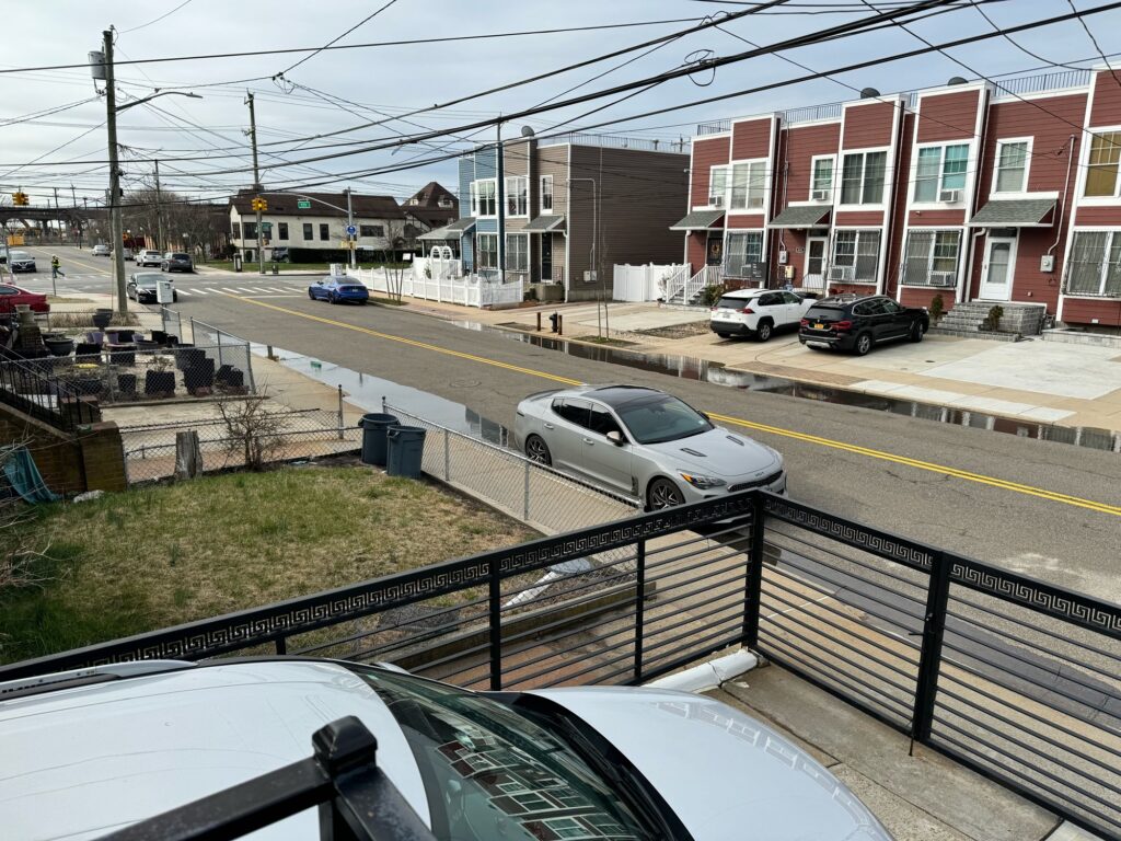 a street with cars and buildings (MyCoast AI)
