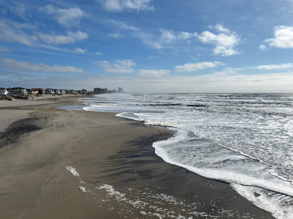 a beach with waves crashing on it (MyCoast AI)