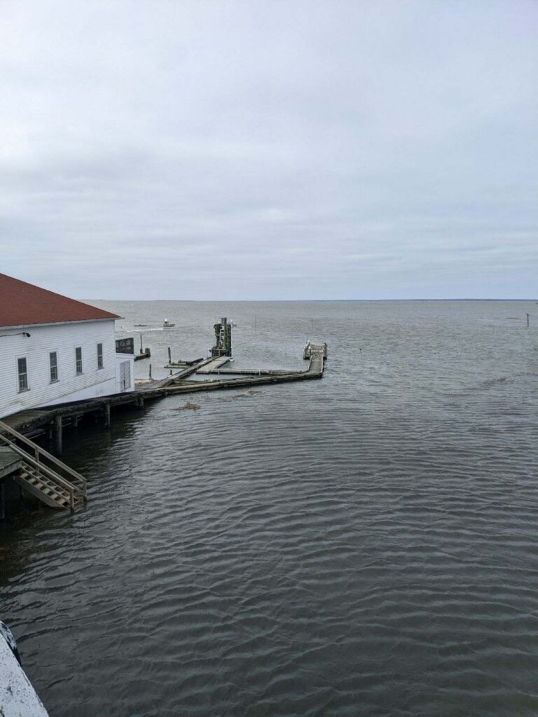 a building on a dock over water (MyCoast AI)