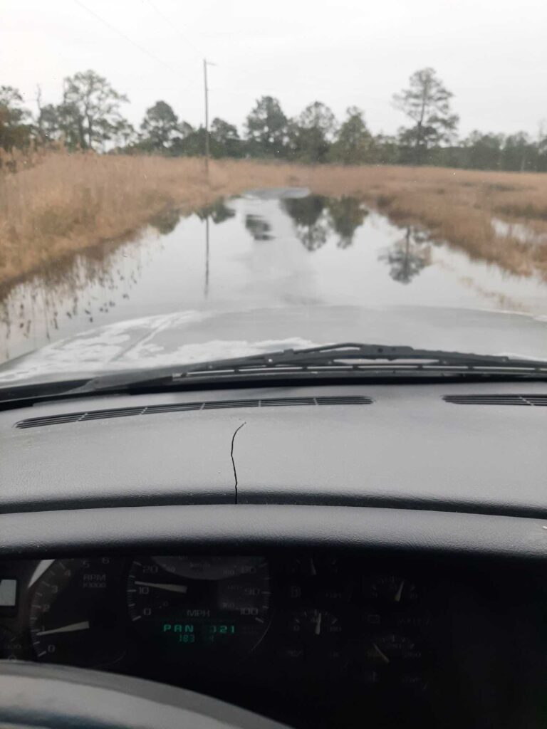 a car driving on a flooded road (MyCoast AI)
