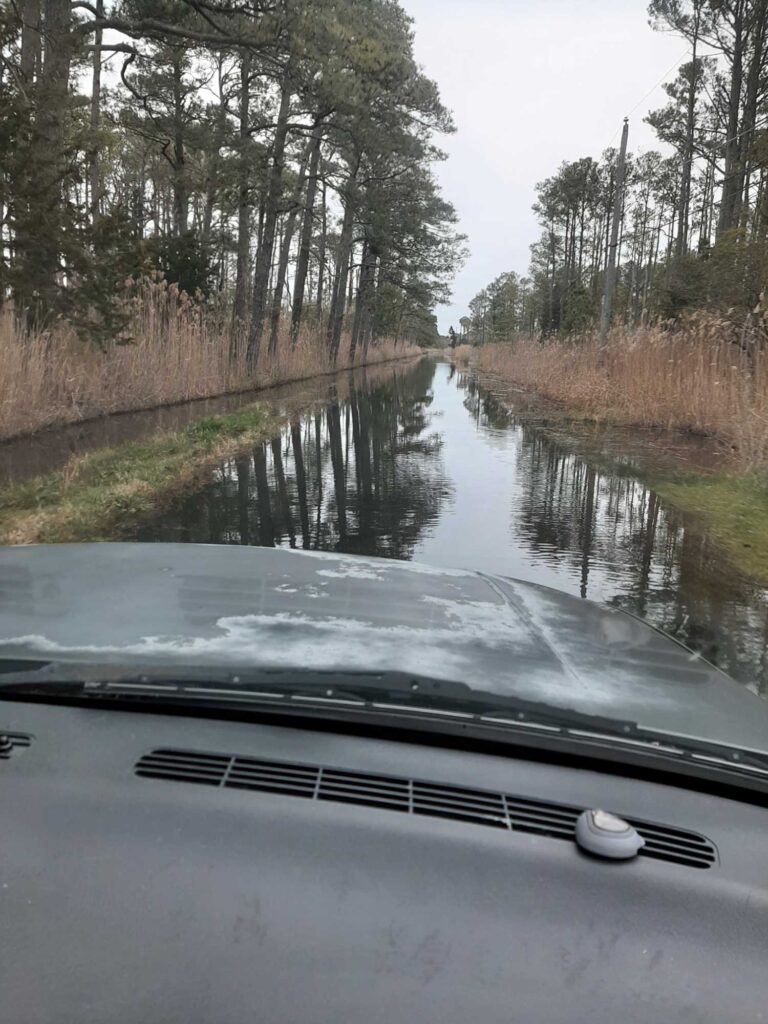 a car driving on a wet road (MyCoast AI)