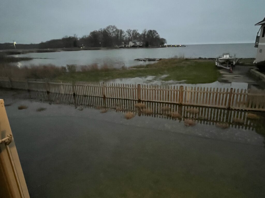 a body of water with a fence and a boat in it (MyCoast AI)