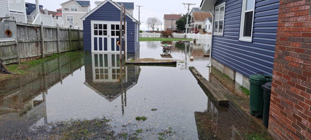 a flooded street with houses (MyCoast AI)