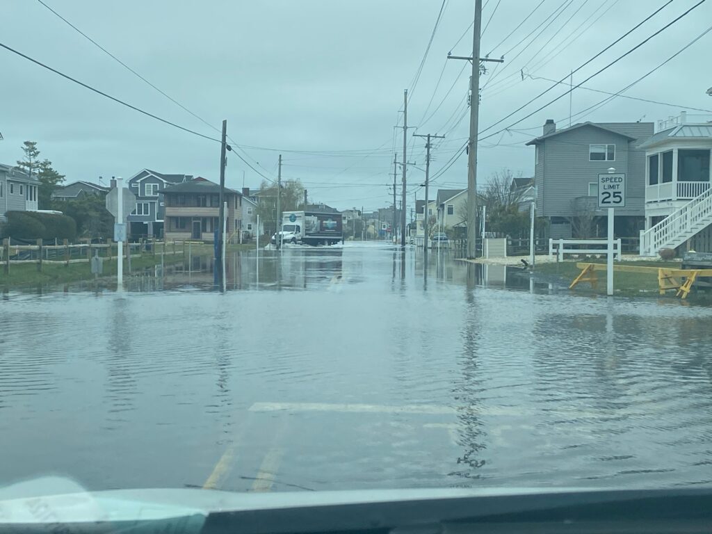 a flooded street with power lines (MyCoast AI)