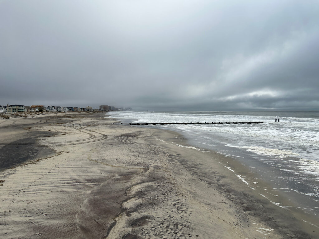 a beach with waves crashing on it (MyCoast AI)