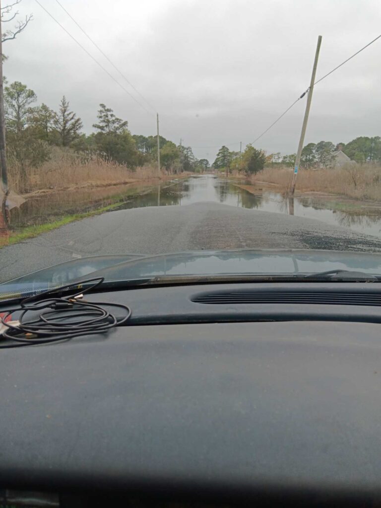 a car driving on a flooded road (MyCoast AI)