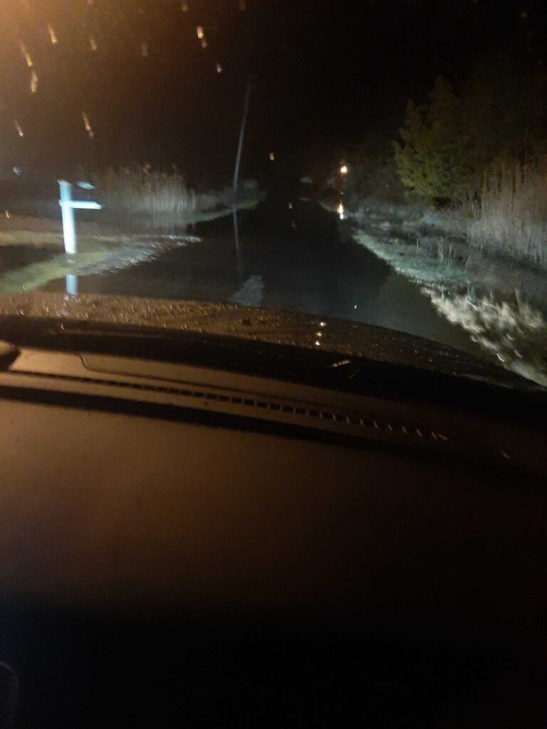 a car driving on a road at night (MyCoast AI)