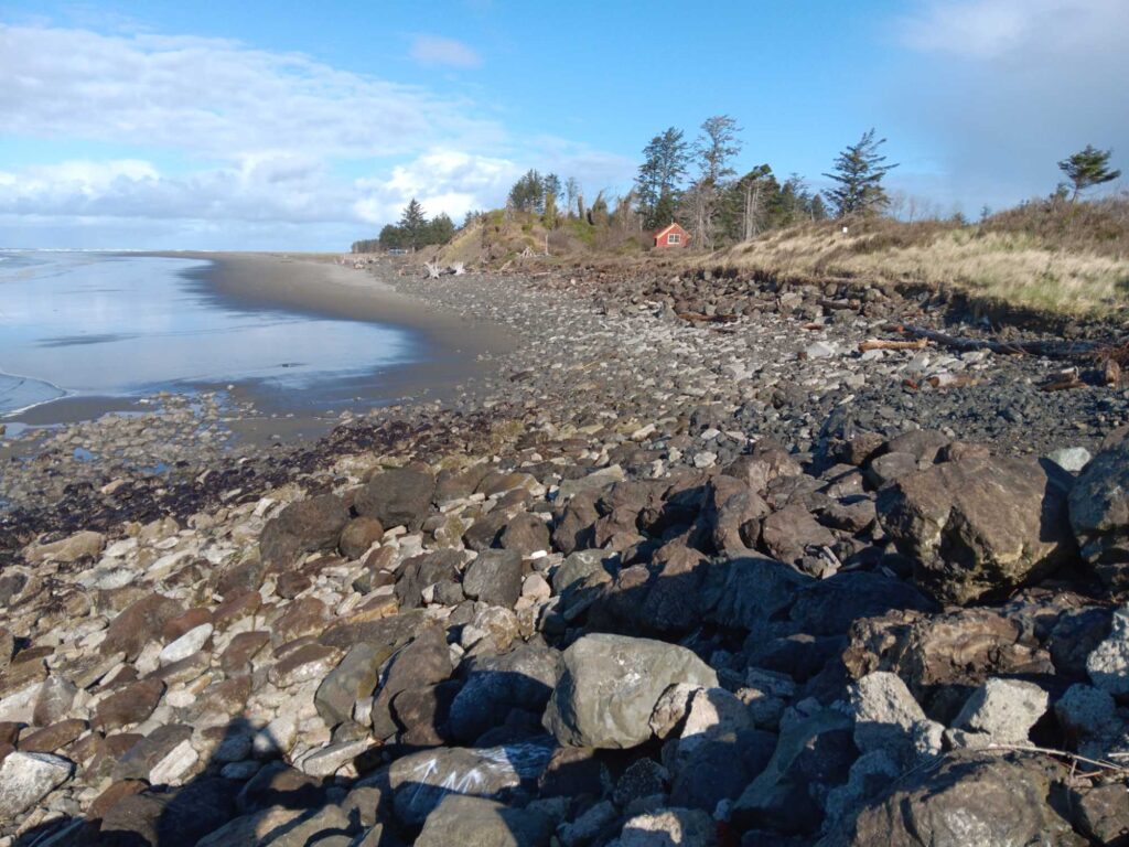 a rocky beach with a body of water in the background (MyCoast AI)