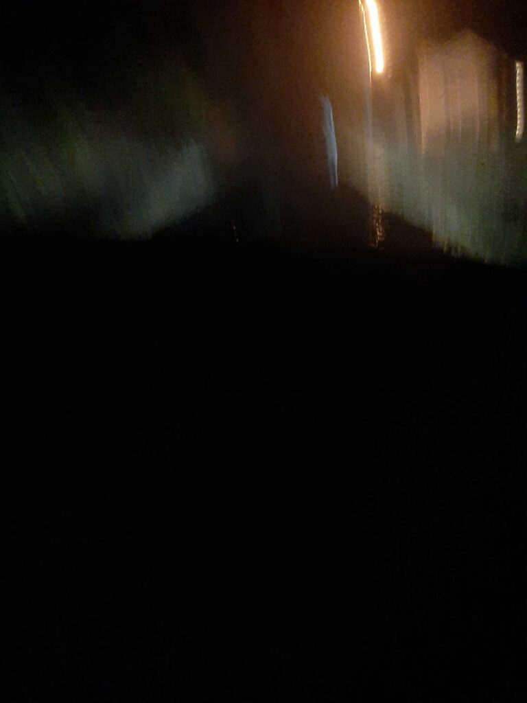 a dark room with a light shining through the window (MyCoast AI)