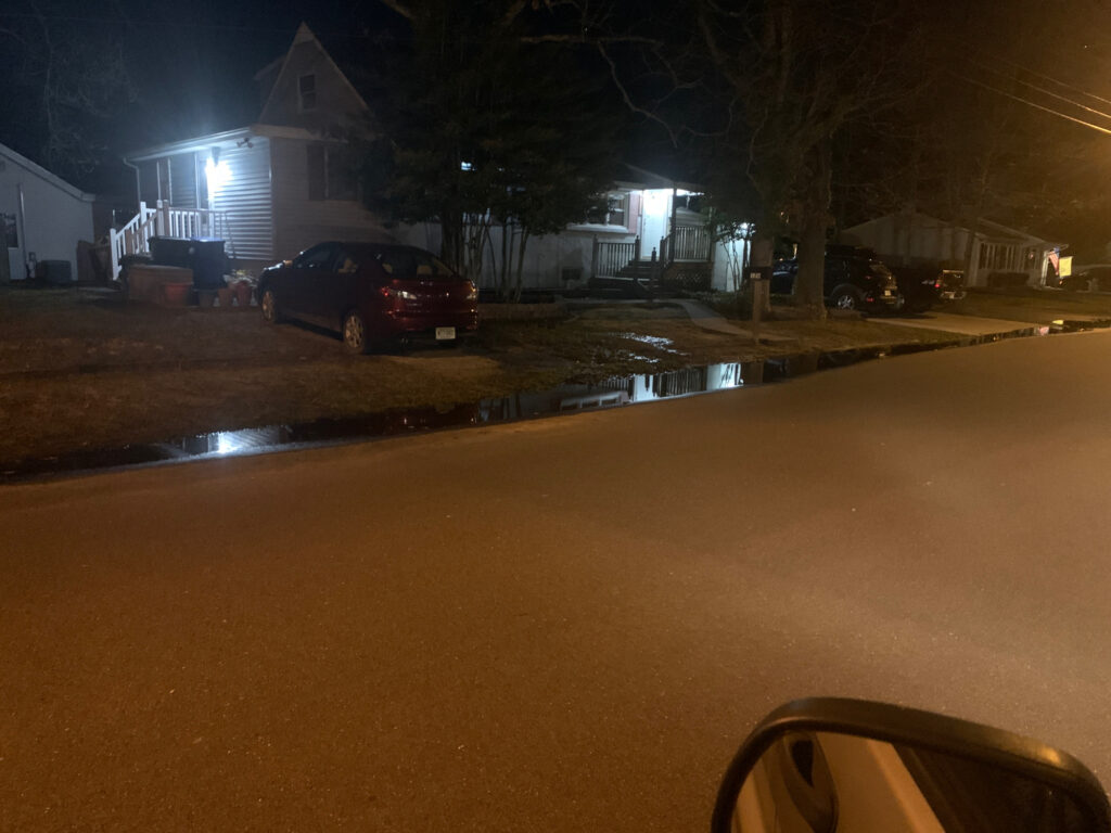a car parked on the side of a road at night (MyCoast AI)