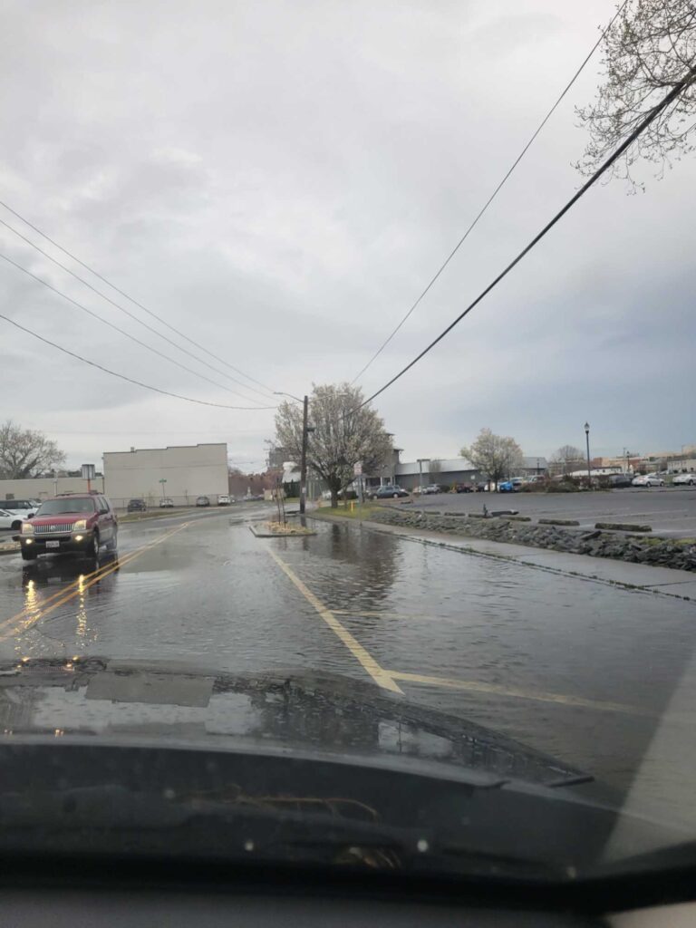 a car driving on a wet road (MyCoast AI)