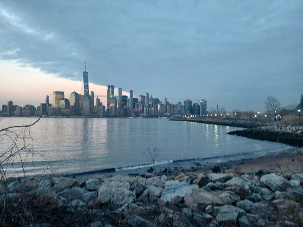 a city skyline across a body of water (MyCoast AI)