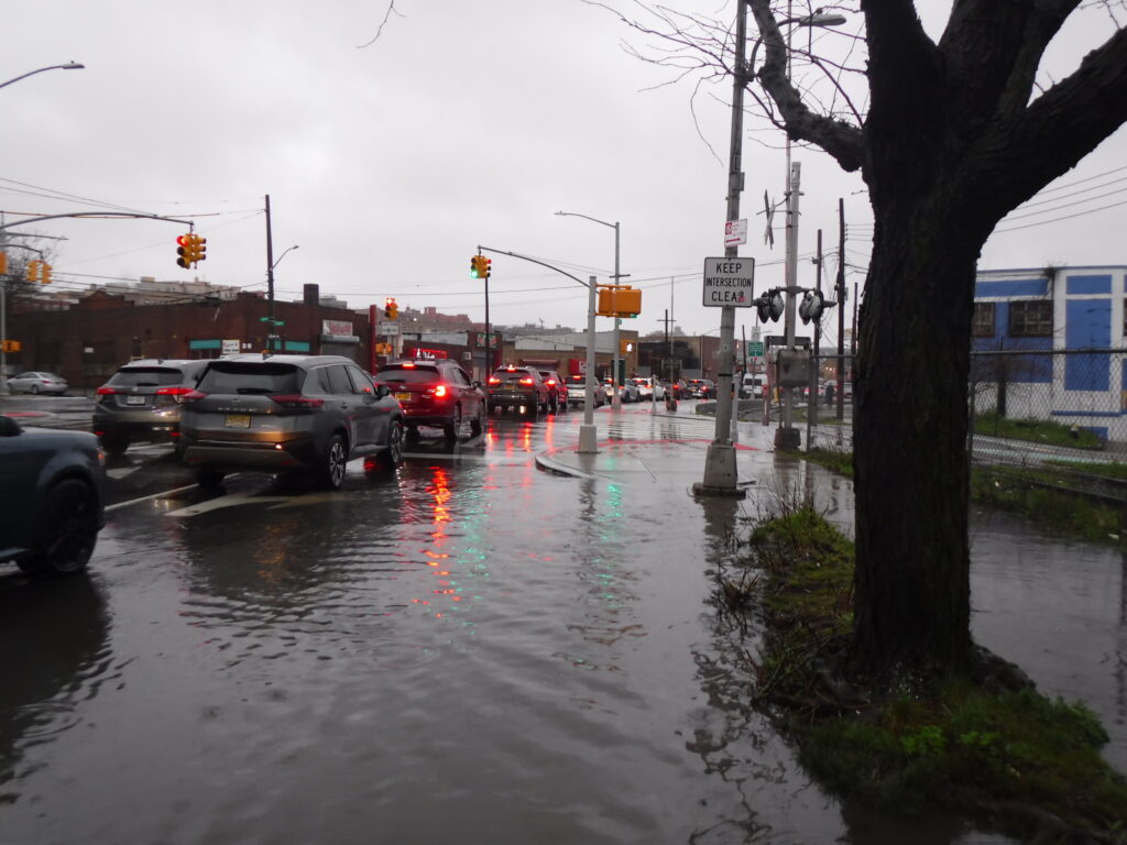 a flooded street with cars (MyCoast AI)