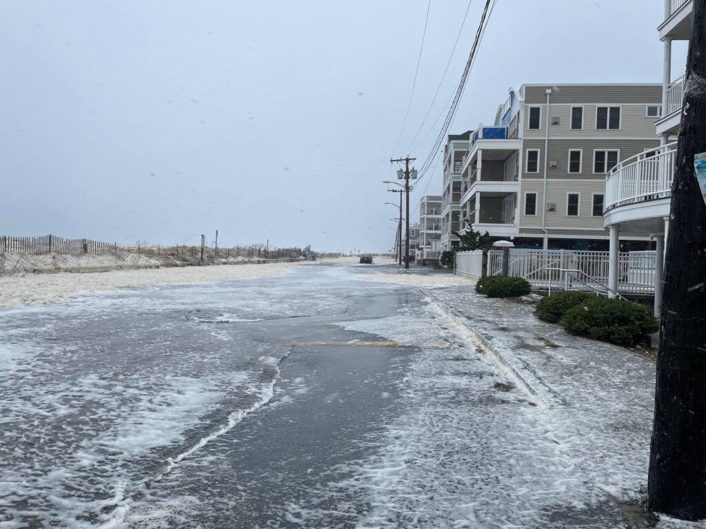 a flooded street with buildings on either side of it (MyCoast AI)