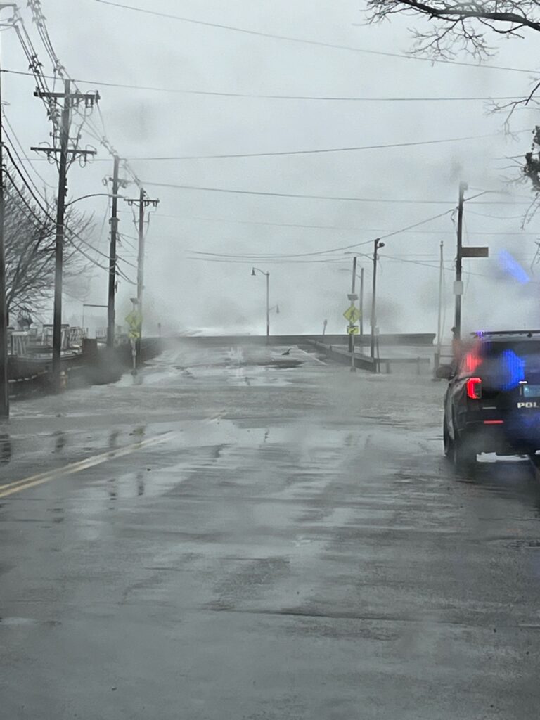 a car driving on a wet road (MyCoast AI)
