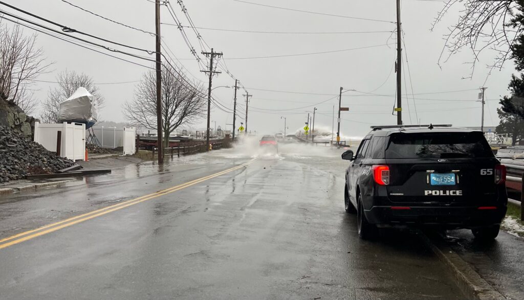 a car on a road with power lines above it (MyCoast AI)