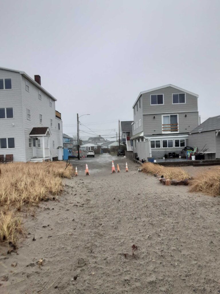 a dirt road with buildings on the side (MyCoast AI)