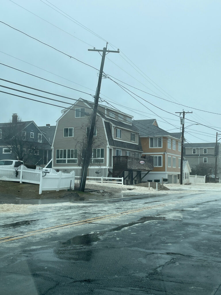 a street with houses and a telephone pole (MyCoast AI)