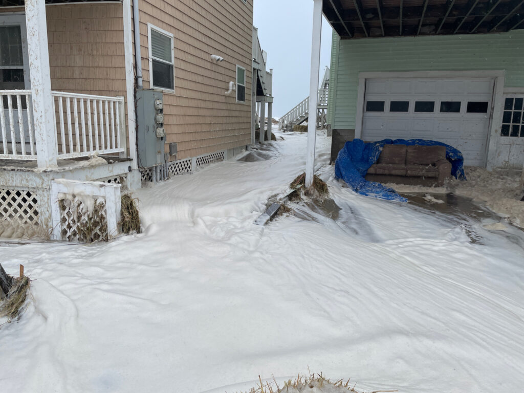 a pile of snow next to a building (MyCoast AI)