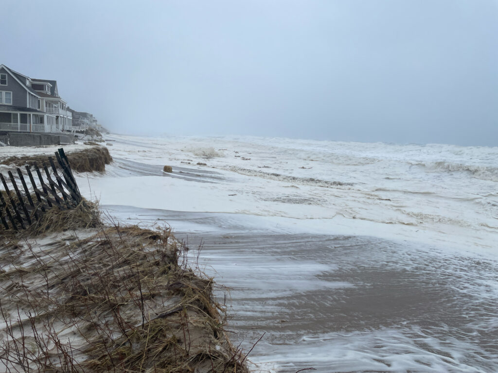 a beach with waves crashing against it (MyCoast AI)