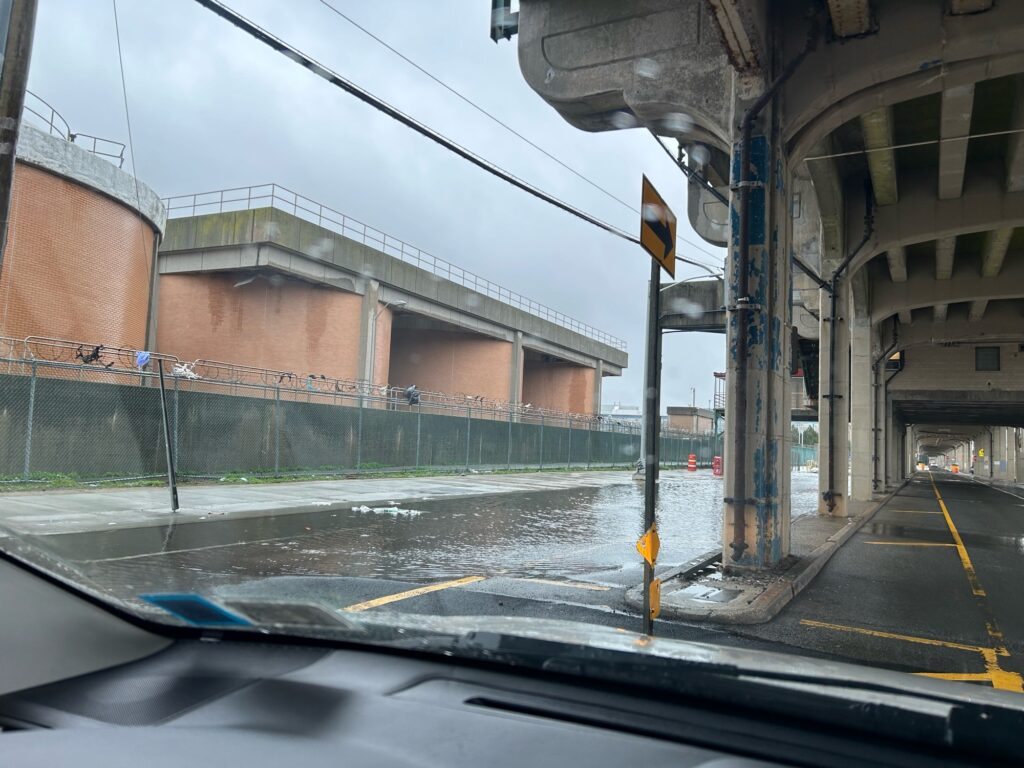 a street with a building and a fence (MyCoast AI)