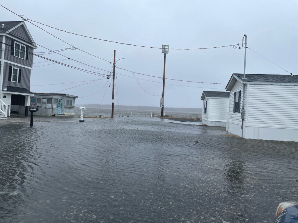 a flooded street with buildings (MyCoast AI)