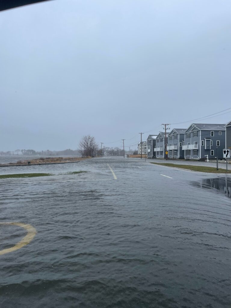 a flooded street with buildings on either side of it (MyCoast AI)