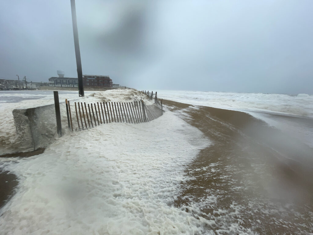 a beach with waves crashing on it (MyCoast AI)