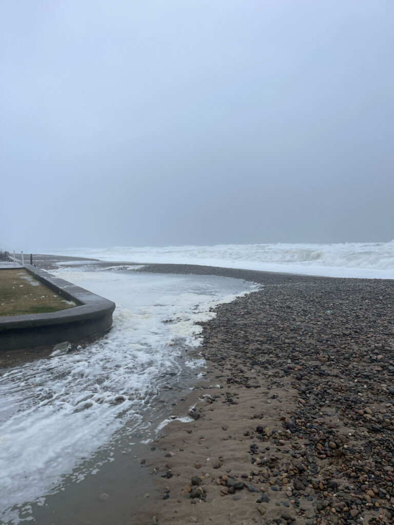 a beach with waves crashing on it (MyCoast AI)
