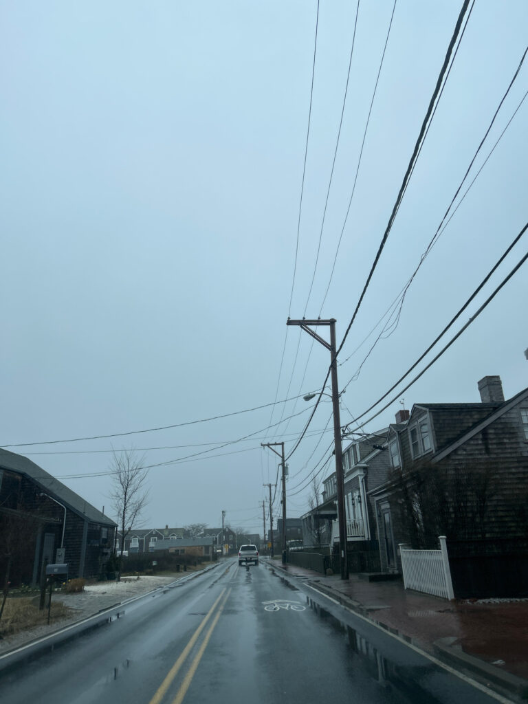 a road with cars on it and buildings on the side (MyCoast AI)